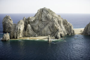 Rocky island in middle of ocean