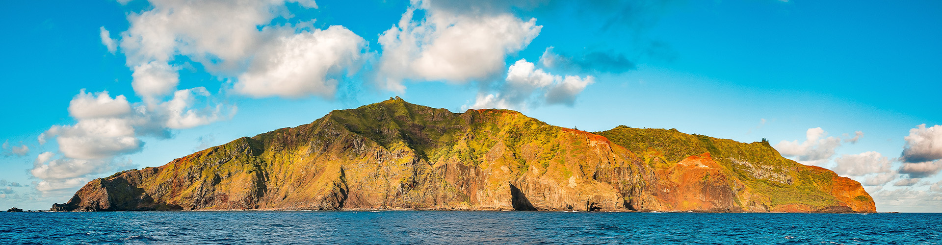 Island in ocean sunny day