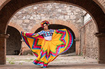 Woman dancing in festive dress