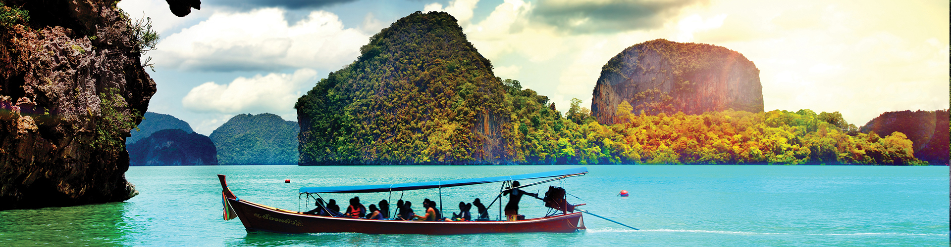 people on a small canoe with islands behind them