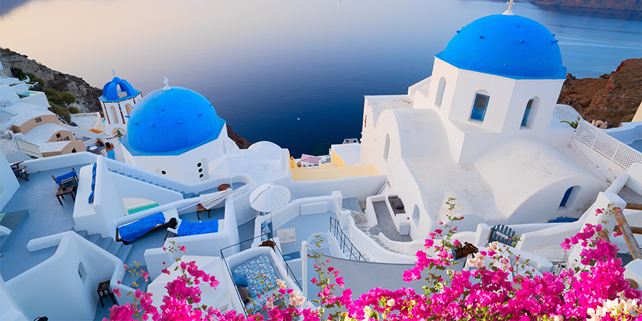 white buildings next to ocean