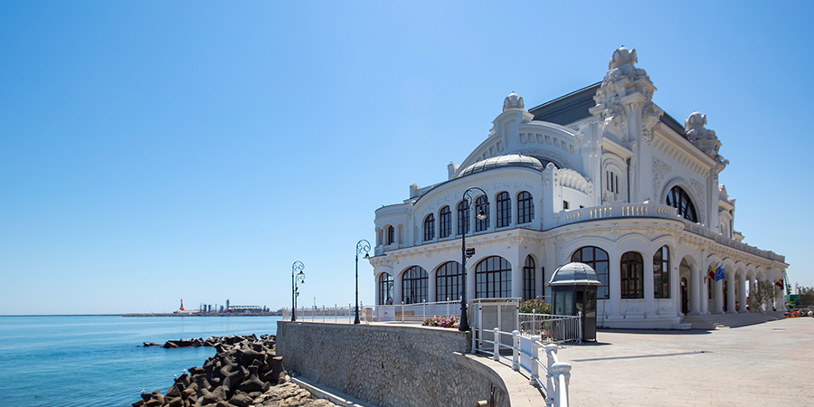 White house on edge of ocean