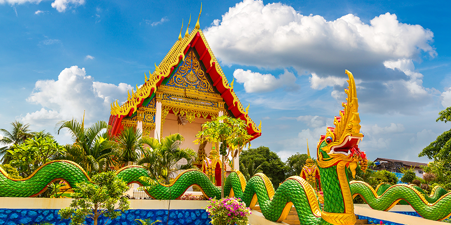 Old building with dragon sculpture in Thailand