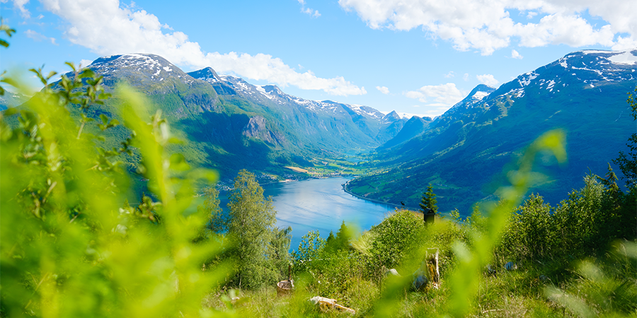 view of lake between mountains