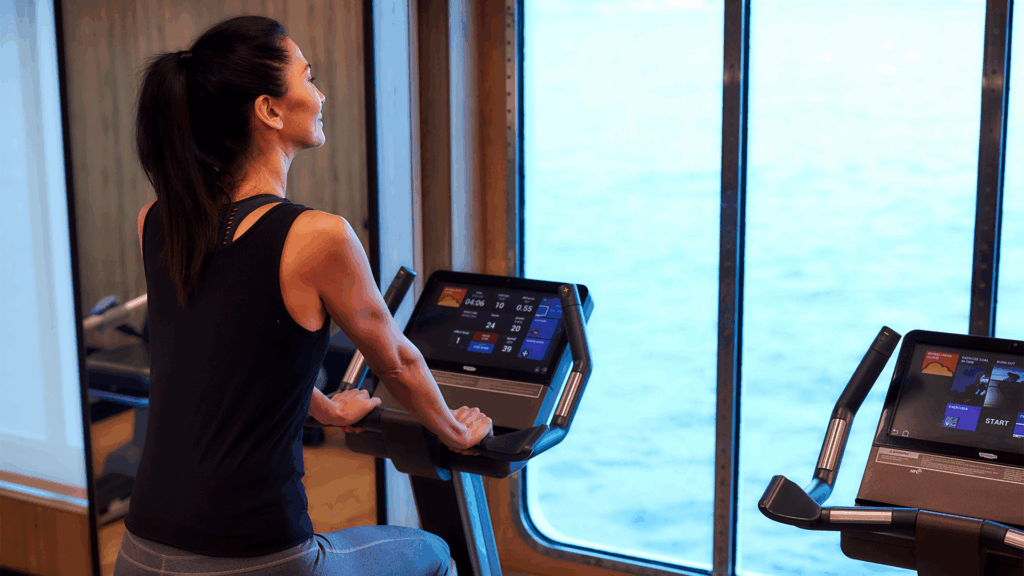 Woman on bicycle workout machine