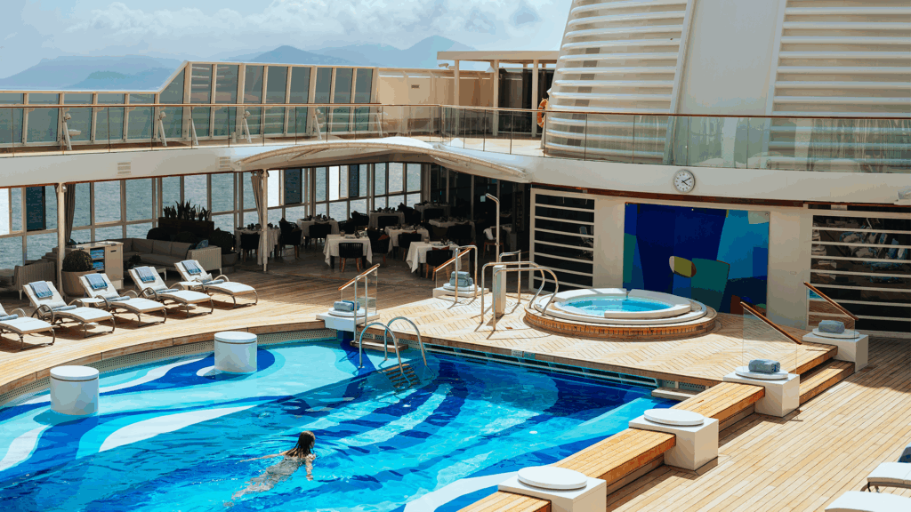 Woman taking a swim in the outdoor pool on the ship deck