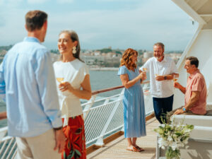 Group of people talking on ship deck