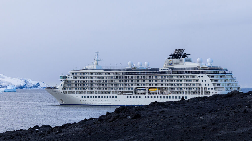 Ship next to iceburg and land
